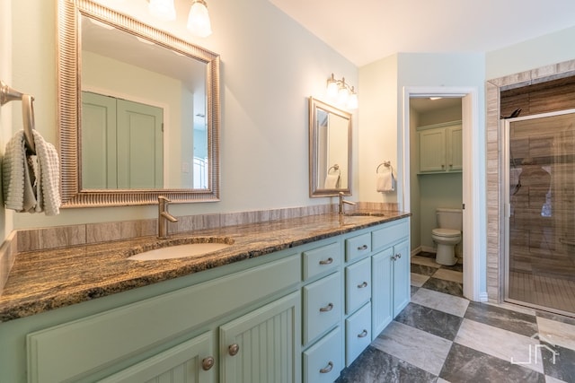 3067 Champions Cir, San Angelo, TX 76904 - full bath featuring double vanity, toilet, and a stall shower