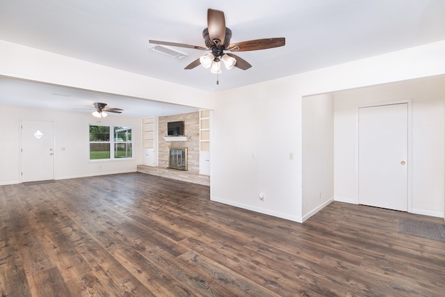 unfurnished living room with dark wood finished floors, visible vents, baseboards, and ceiling fan