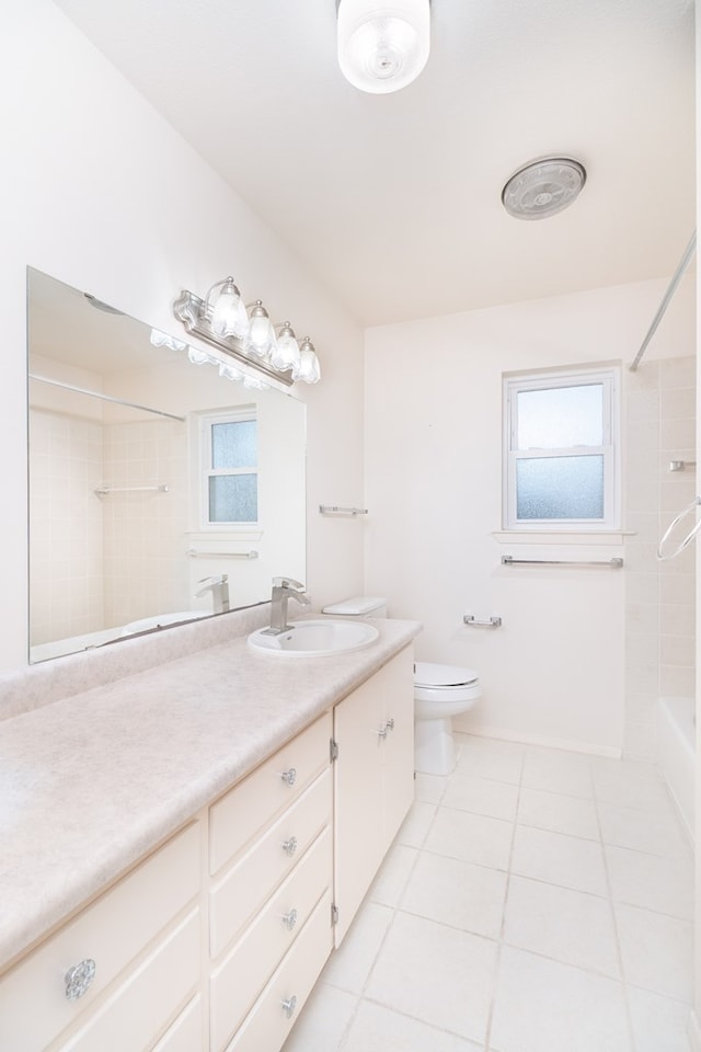 full bath featuring toilet, tile patterned flooring, vanity, and shower / bathtub combination