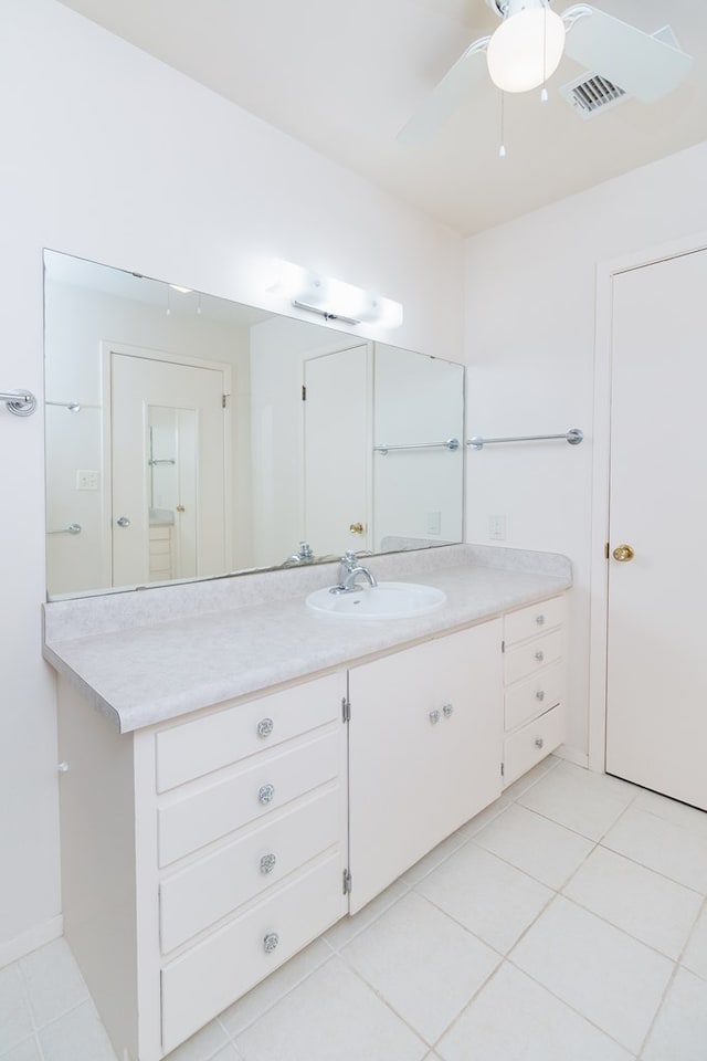 bathroom with a ceiling fan, visible vents, tile patterned flooring, and vanity