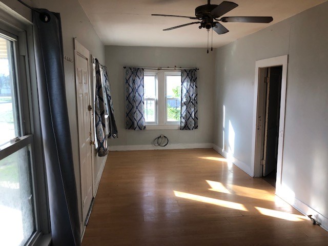 spare room featuring light hardwood / wood-style floors and ceiling fan