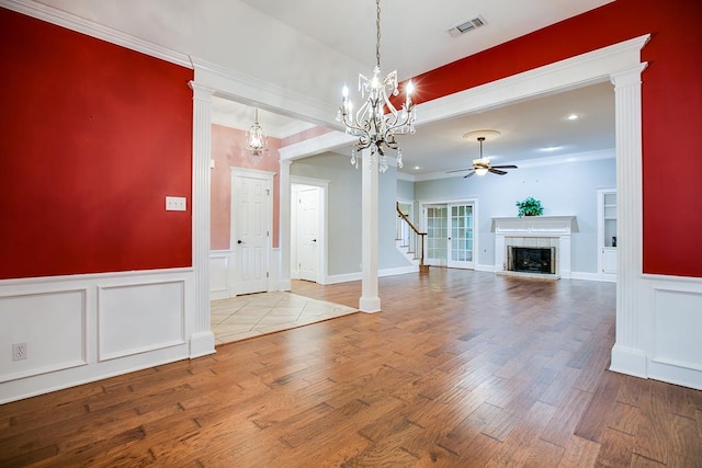 5413 Bent Oak Ct, San Angelo, TX 76904 - entrance foyer with ceiling fan, a fireplace, wood finished floors, a decorative wall, and stairs