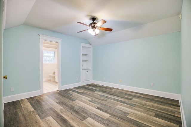 5413 Bent Oak Ct, San Angelo, TX 76904 - unfurnished bedroom with vaulted ceiling, wood finished floors, baseboards, ensuite bath, and a ceiling fan
