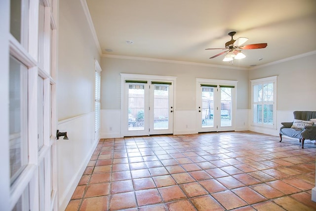 5413 Bent Oak Ct, San Angelo, TX 76904 - doorway to outside with a ceiling fan, a decorative wall, wainscoting, crown molding, and french doors
