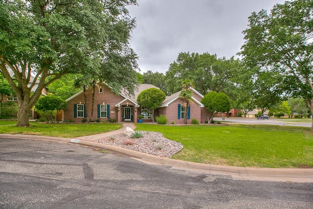 5413 Bent Oak Ct, San Angelo, TX 76904 - view of front of house featuring brick siding and a front yard