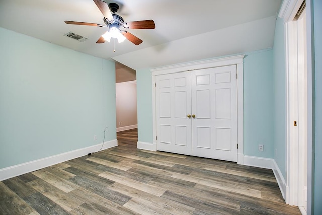 5413 Bent Oak Ct, San Angelo, TX 76904 - unfurnished bedroom with baseboards, wood finished floors, vaulted ceiling, a closet, and a ceiling fan
