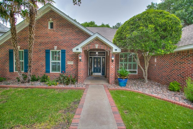 5413 Bent Oak Ct, San Angelo, TX 76904 - traditional home with brick siding, a front yard, and roof with shingles