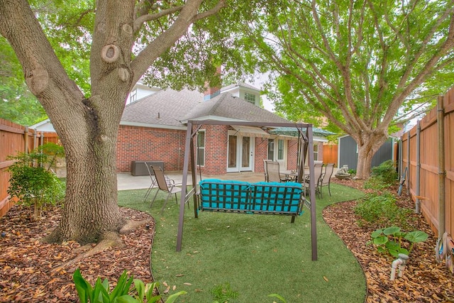 5413 Bent Oak Ct, San Angelo, TX 76904 - back of property featuring brick siding, roof with shingles, a pergola, a patio area, and an outdoor structure