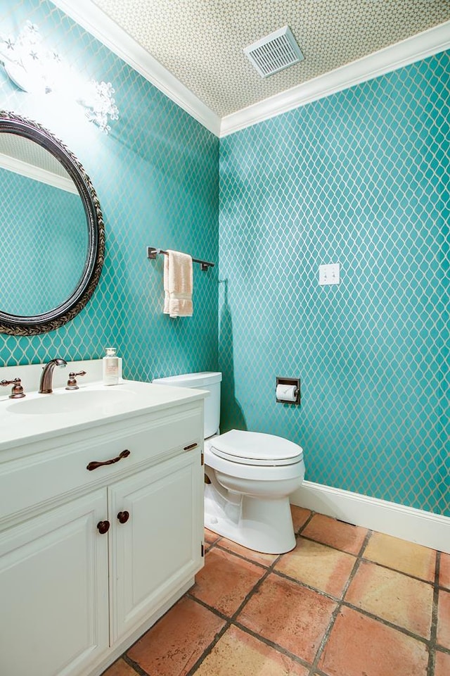 5413 Bent Oak Ct, San Angelo, TX 76904 - bathroom with crown molding, vanity, toilet, and stone tile flooring