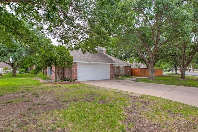 5413 Bent Oak Ct, San Angelo, TX 76904 - view of front facade with an attached garage, brick siding, and driveway