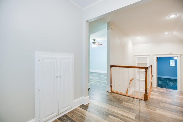 5413 Bent Oak Ct, San Angelo, TX 76904 - corridor featuring an upstairs landing, wood finished floors, baseboards, crown molding, and recessed lighting