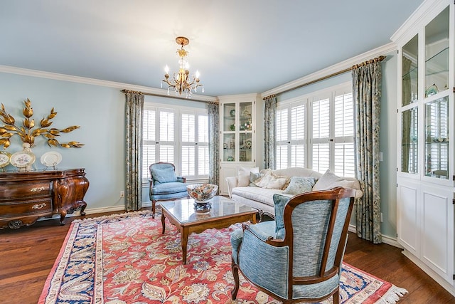 living room with an inviting chandelier, ornamental molding, and dark hardwood / wood-style flooring