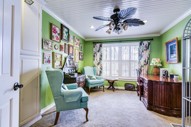 sitting room featuring ceiling fan, ornamental molding, and light carpet