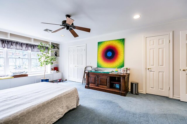 bedroom featuring crown molding, carpet floors, and ceiling fan