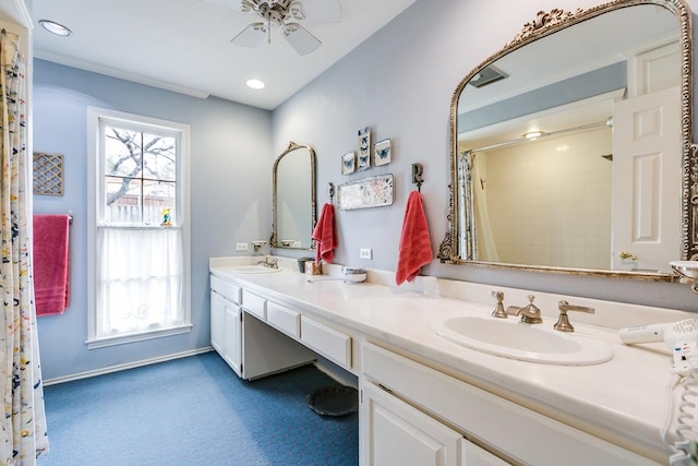 bathroom featuring walk in shower, ceiling fan, and vanity