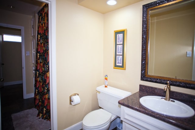 5114 Fairway Dr, San Angelo, TX 76904 - bathroom with vanity, toilet, and baseboards