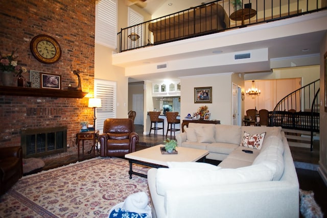 5114 Fairway Dr, San Angelo, TX 76904 - living area with a high ceiling, a chandelier, stairway, and a fireplace