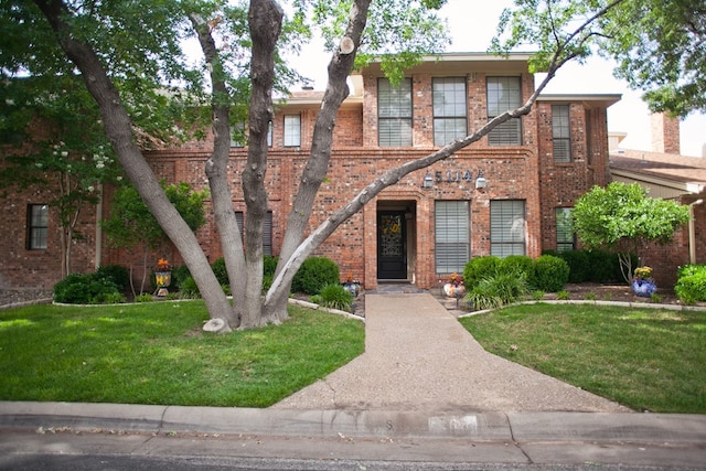 5114 Fairway Dr, San Angelo, TX 76904 - view of front of home with a front yard and brick siding