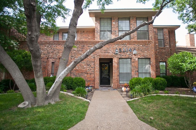 5114 Fairway Dr, San Angelo, TX 76904 - view of front of house with brick siding and a front lawn