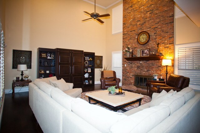 5114 Fairway Dr, San Angelo, TX 76904 - living area with a towering ceiling, wood finished floors, a ceiling fan, ornamental molding, and a fireplace
