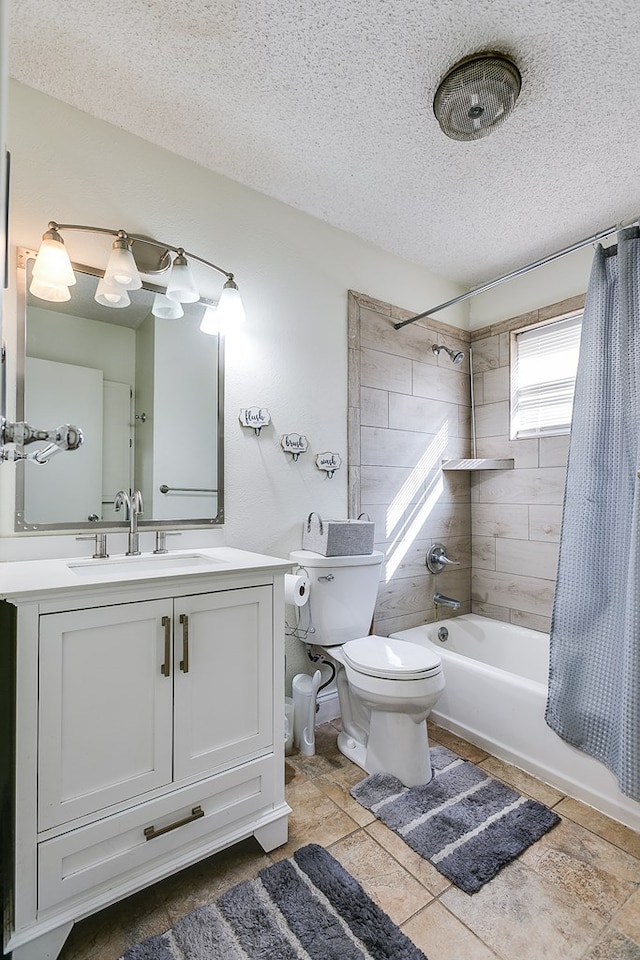 full bathroom featuring vanity, shower / tub combo, toilet, and a textured ceiling