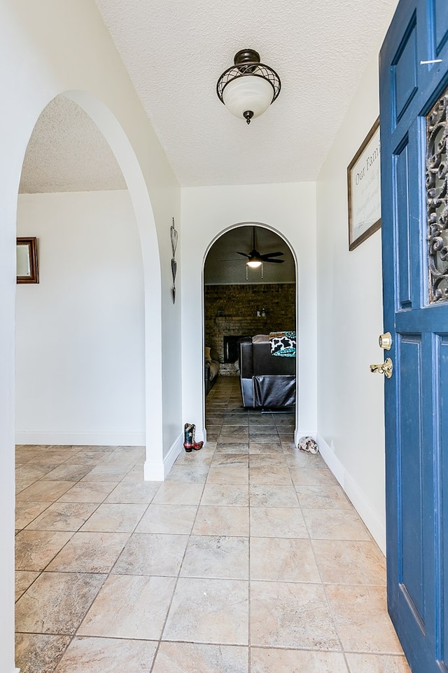 foyer featuring a textured ceiling