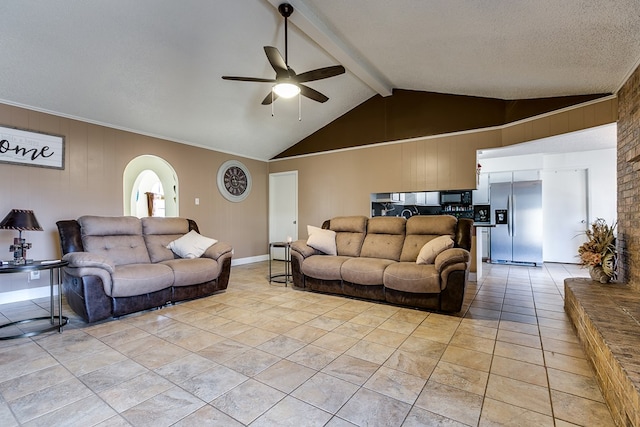 living room featuring wooden walls, lofted ceiling with beams, and ceiling fan