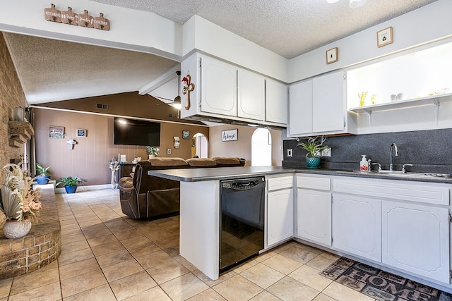 kitchen with light tile patterned flooring, sink, dishwasher, kitchen peninsula, and white cabinets