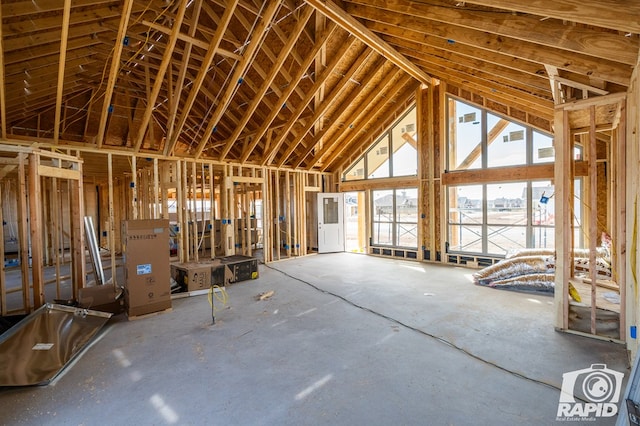 misc room with high vaulted ceiling