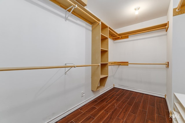 walk in closet with wood tiled floor