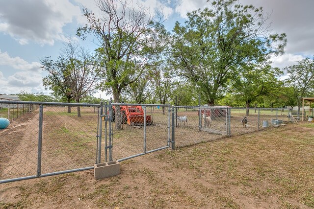 view of yard featuring a gate and fence