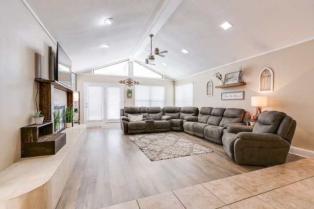 living room featuring vaulted ceiling with beams, ceiling fan, and light hardwood / wood-style floors