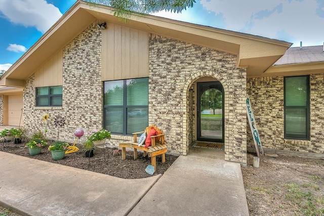 entrance to property featuring a garage