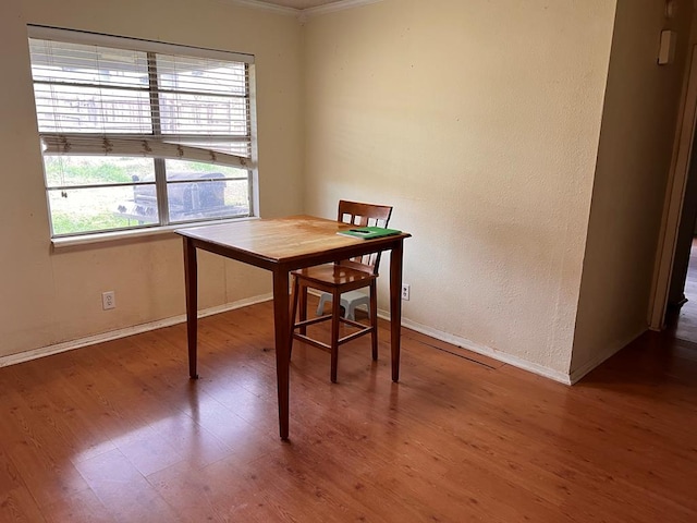 office space with hardwood / wood-style flooring and crown molding