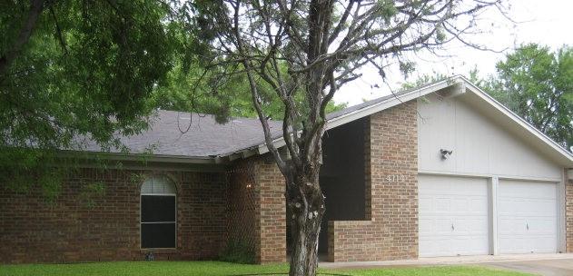 view of side of property featuring a garage