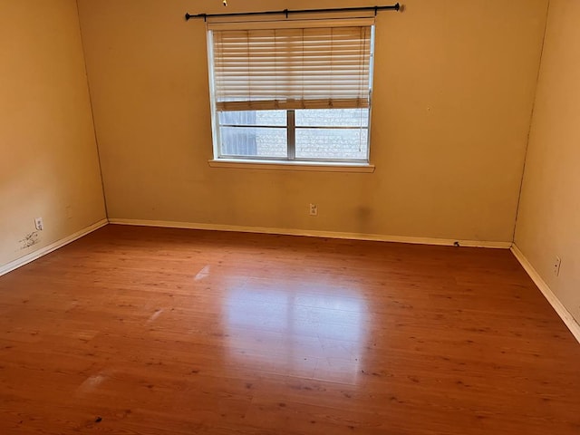 unfurnished room featuring hardwood / wood-style floors