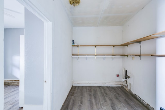 clothes washing area featuring laundry area and wood finished floors