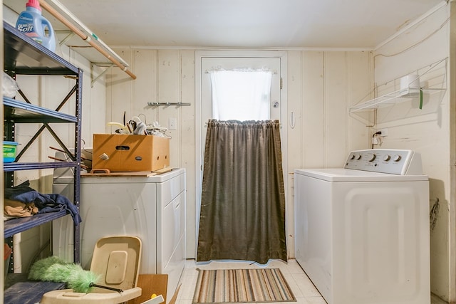 washroom featuring light tile patterned flooring and washer / dryer