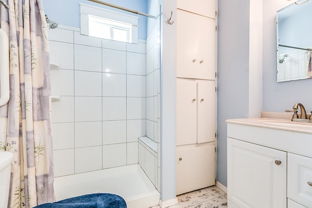 bathroom with vanity and a shower with shower curtain