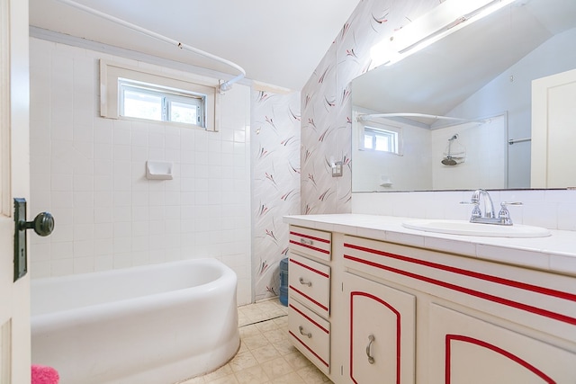 bathroom with shower / bathtub combination with curtain, vanity, and lofted ceiling