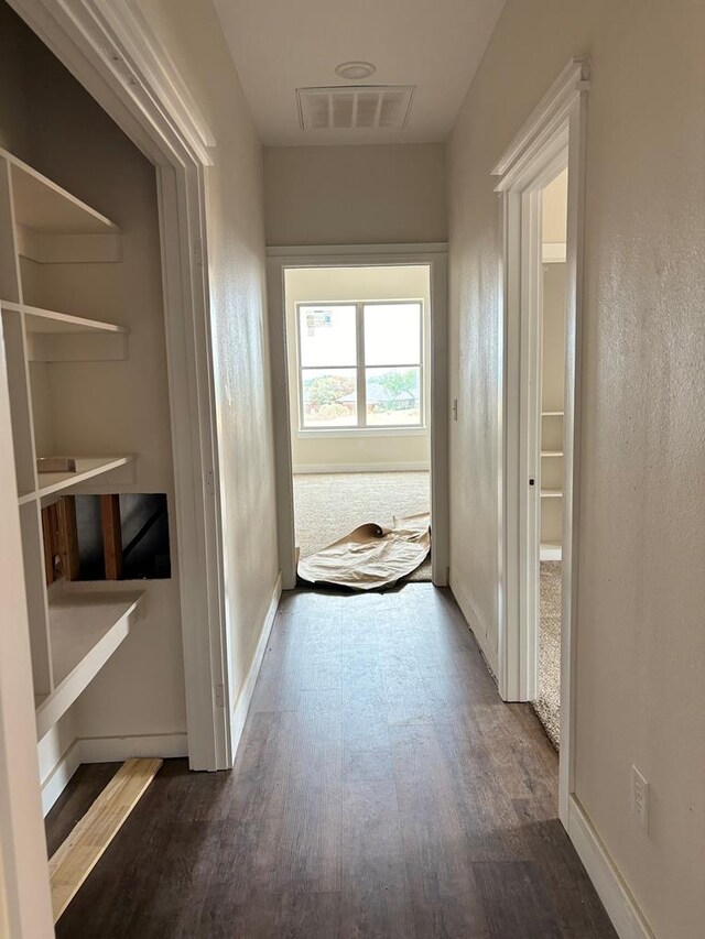 hallway featuring dark hardwood / wood-style floors