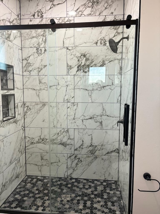 bathroom featuring a shower stall