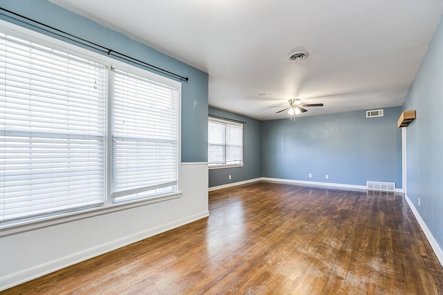 unfurnished room with hardwood / wood-style floors and ceiling fan