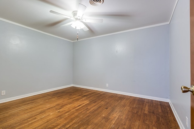 spare room featuring hardwood / wood-style floors, ornamental molding, and ceiling fan