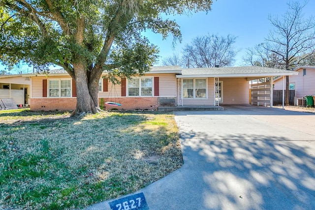 single story home with a carport and a front yard