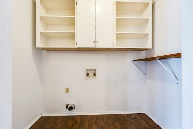 washroom featuring hookup for a washing machine, dark hardwood / wood-style floors, hookup for an electric dryer, and cabinets