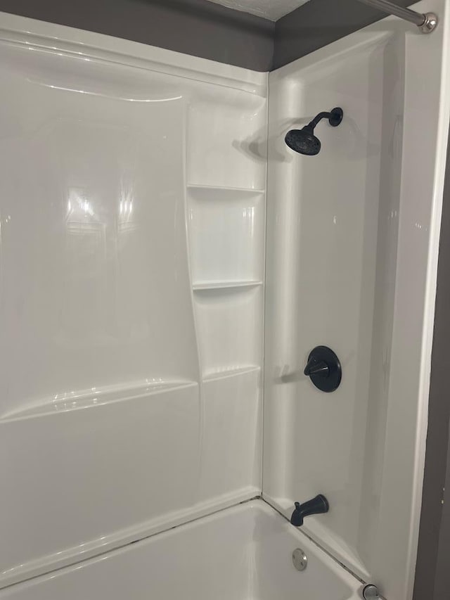 bathroom with shower / tub combination