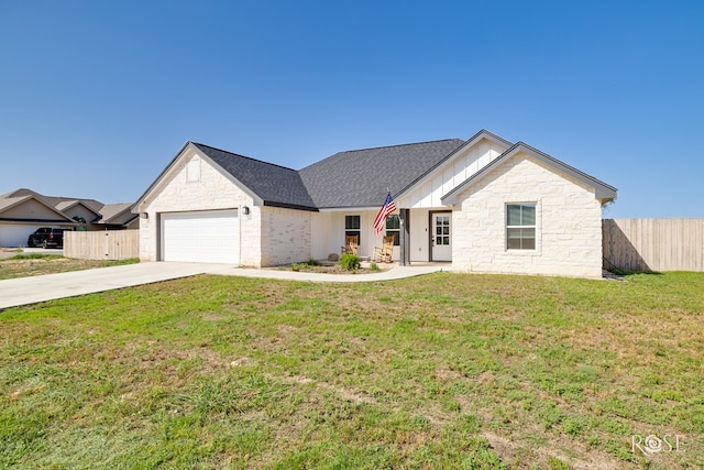 2846 Ricks Dr, San Angelo, TX 76905 - view of front of house with a garage, driveway, stone siding, and board and batten siding