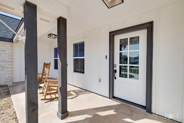 2846 Ricks Dr, San Angelo, TX 76905 - view of exterior entry with board and batten siding and a porch