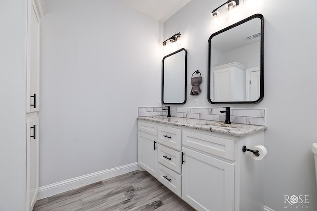 2846 Ricks Dr, San Angelo, TX 76905 - bathroom with double vanity and wood finished floors